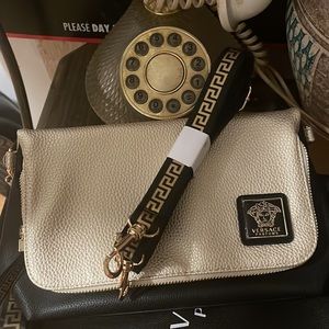 Beautiful authentic Versace bag can be wore as a clutch or Crossbody bag